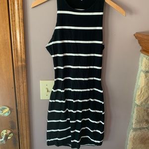 Form fitting with open back, white and black dress